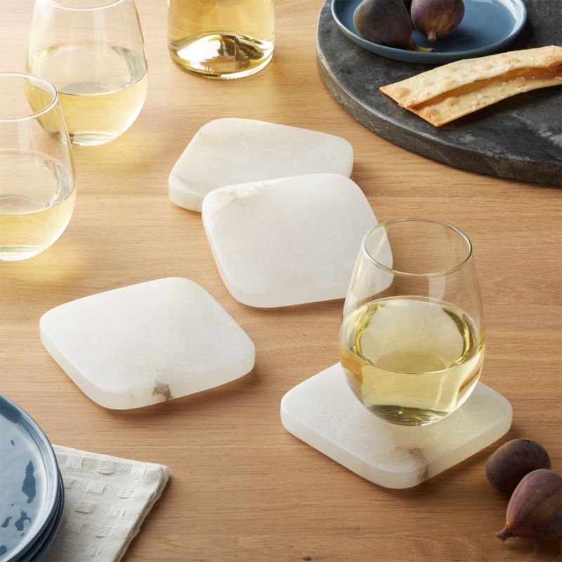 White alabaster coaster set of four with natural veining and translucent stone finish