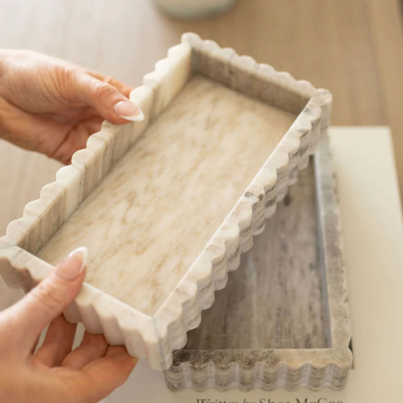 Beige scalloped marble bridge tray with natural stone veining for kitchen sink, countertop, or vanity organization