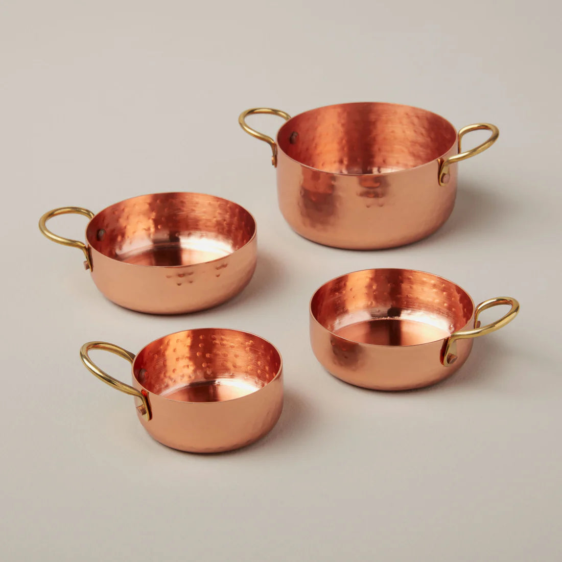 Camden hammered copper measuring cups set with rippled texture and food-safe finish