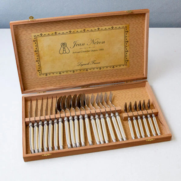 Laguiole 24 piece platine ivory flatware set with forks, knives, spoons, and teaspoons in a wooden presentation box